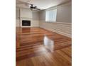 Living room with a fireplace, hardwood floors, and freshly painted walls at 1055 Worthington Hills Dr, Roswell, GA 30076