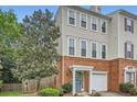 Side view of this multi-story townhome with an attached garage, and landscaped front yard at 1928 Stancrest Nw Trce, Kennesaw, GA 30152