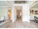 Bright foyer with wood floors leading into the house's various rooms and open spaces at 21 Whitegrass Way, Grayson, GA 30017