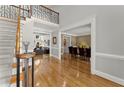 Open foyer featuring hardwood floors, staircase, and a view into the living and dining rooms at 300 Morganshire Pl, Atlanta, GA 30350