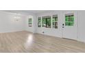Bright living room featuring hardwood floors, white walls, and abundant natural light at 644 Church Nw St, Atlanta, GA 30318