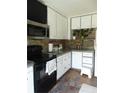 Well-lit kitchen boasts modern appliances and ample storage space at 126 Brittany Dr, Canton, GA 30115