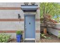 Stylish front door with brick-lined concrete block, covered entryway and decorative landscaping at 542 Ralph Mcgill Ne Blvd # 7, Atlanta, GA 30312