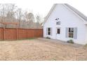 Spacious backyard featuring a well-maintained lawn and detached garage at 762 Thompson Ln, Loganville, GA 30052