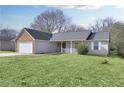 Street view of charming home showcasing the lush front lawn and covered front porch at 6057 Dorchester Dr, Rex, GA 30273