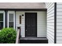 Close-up of the front door with modern house number and outdoor lighting at 2442 Falcon Ct, Lawrenceville, GA 30043