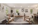 Bright living room with stylish furnishings, hardwood floors, and large windows for natural light at 376 Pine Ne St, Marietta, GA 30060