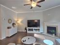 Bright living room with a fireplace, modern furnishings, and hardwood floors at 2264 Shetley Creek Dr, Norcross, GA 30071