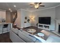 Open concept living area with hardwood floors connecting to the kitchen at 2264 Shetley Creek Dr, Norcross, GA 30071