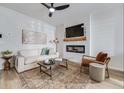 Modern living room with a decorative accent wall, stylish furniture, and an electric fireplace at 235 Ivey Ter, Temple, GA 30179