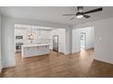Bright living room featuring hardwood floors, an open-concept view of the kitchen at 2438 Whites Rdg, Decatur, GA 30034