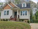 Inviting home with well-manicured landscaping leading to the front door, complete with a clean, tidy aesthetic at 4075 Sw Fairburn Sw Ave, Atlanta, GA 30331