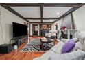 Basement living area with a bar, tv, and ample seating at 2030 Spring End Ct, Lawrenceville, GA 30044