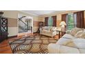 Cozy living room showcasing wood floors and views to the stairway at 2030 Spring End Ct, Lawrenceville, GA 30044
