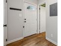 Welcoming entryway with hardwood floors, coat hooks, and neutral wall paint at 346 Carpenter Dr # 77, Sandy Springs, GA 30328