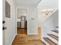Hallway entrance to kitchen showcasing stainless steel refrigerator and light fixtures at 346 Carpenter Dr # 77, Sandy Springs, GA 30328