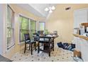 Bright breakfast nook with tile floors and a large picture window at 5181 Saint Claire Pl, Powder Springs, GA 30127