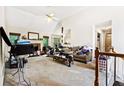 Bright living room featuring carpet and a fireplace at 5181 Saint Claire Pl, Powder Springs, GA 30127