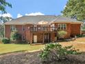 Spacious backyard with a large wooden deck perfect for outdoor entertaining and relaxation at 925 Champions Way, Mcdonough, GA 30252