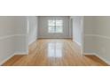 Light-filled dining area with beautiful wood floors and views to the outside at 3717 Lockerbie Ln, Powder Springs, GA 30127