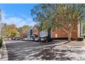 Apartment community complex with parking lot full of cars, surrounded by landscaping at 3302 Dogwood Dr # 328, Atlanta, GA 30354