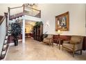 Apartment lobby with staircase, tile floor, seating, large artwork, and view of hallway at 3302 Dogwood Dr # 328, Atlanta, GA 30354