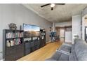 Comfortable living room with hardwood floors, media center, and stylish furnishings with a large window at 361 17Th Nw St # 2315, Atlanta, GA 30363