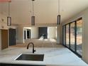 Bright kitchen with stainless steel fixtures and access to a living space with a fireplace and sliding glass doors at 3066 Reserve Sw Ct, Conyers, GA 30094