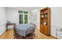 Cozy dining room featuring wood floors, large window, and classic decor for enjoyable meals at 68 Willow Ne Gln, Atlanta, GA 30342
