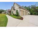 Spacious three-car garage offering ample parking and storage, with a convenient driveway and lush landscaping at 131 Forsyth Park Ln, Woodstock, GA 30188