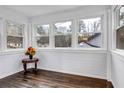 Bright sunroom featuring hardwood floors, white shiplap walls, and an abundance of natural light at 1747 Parkhill Dr, Decatur, GA 30032