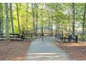 Elegant gated entrance with black metal gates and landscaping at the entrance of the property at 2203 Arbor Hill Rd, Canton, GA 30115