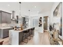 Modern kitchen features stainless steel appliances, gray cabinetry, and large island with bar seating at 701 Pryor Sw St # 5, Atlanta, GA 30315