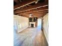Open living space with fireplace, natural light, and potential for restoration and personalization at 1386 Bluefield Sw Dr, Atlanta, GA 30310