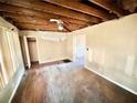 Spacious living room with exposed ceiling, offering potential for customization and renovation at 1386 Bluefield Sw Dr, Atlanta, GA 30310