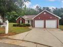 Beautiful home with a two-car garage, landscaped front yard and visible address at 3146 Leyland Ct, Decatur, GA 30034