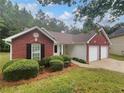 Attractive home featuring a manicured lawn and an attached two-car garage at 3146 Leyland Ct, Decatur, GA 30034