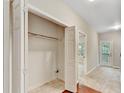 Entryway area featuring tile flooring, a closet, and neutral-toned walls at 2173 Pebble Beach Dr, Lawrenceville, GA 30043