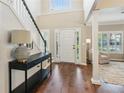 Grand foyer featuring hardwood floors, a staircase, and ample natural light creating a warm and inviting entry at 2713 Stillwater Lake Ln, Marietta, GA 30066