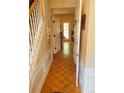 Welcoming foyer with hardwood floors, white trim, and an open doorway revealing the light-filled interior at 215 Boca Ciega Ct, Alpharetta, GA 30022