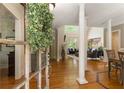 Welcoming foyer with hardwood floors, columns, and view into the living room at 4404 Old Georgetown Trl, Atlanta, GA 30338