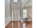 Bright foyer with hardwood floors, neutral walls, and a view of the staircase at 4885 Maristone Landing Way, Cumming, GA 30040