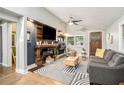 Stylish living room with modern decor, fireplace, and plenty of natural light at 677 Holmes Nw St, Atlanta, GA 30318