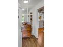Charming entryway with gleaming hardwood floors and view into other rooms at 157 Maribeau Nw Sq, Atlanta, GA 30327