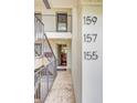 Townhome entrance showing staircase and doors to units 155, 157, and 159 at 157 Maribeau Nw Sq, Atlanta, GA 30327