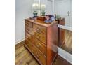 Close up of a lovely wooden dresser with hardwood floors and attractive decor at 157 Maribeau Nw Sq, Atlanta, GA 30327