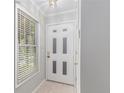 Bright entryway featuring a white front door with decorative window panels at 2105 Country Park Se Dr, Smyrna, GA 30080