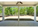 Covered patio with columns offers an outdoor space, perfect for relaxing, and enjoying the peaceful backyard view at 2749 Porches Ln, Dacula, GA 30019