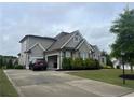 Large single Gathering house on a large lot with manicured front yard at 312 Archway Ln, Peachtree City, GA 30269