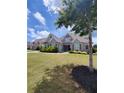 Charming two-story home with well-manicured lawn and beautiful landscaping at 312 Archway Ln, Peachtree City, GA 30269